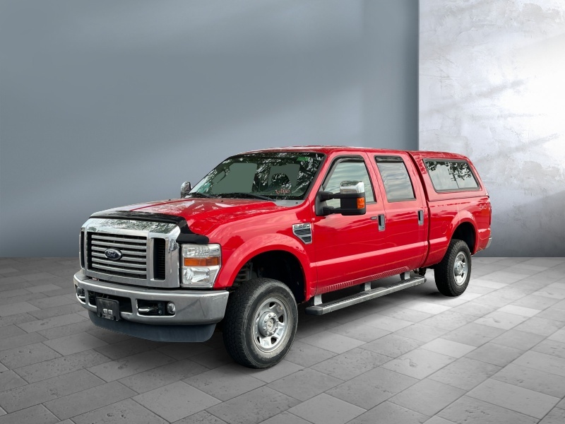 Red 2009 Ford F-250 Super Duty Pickup Truck Four-Wheel Drive 